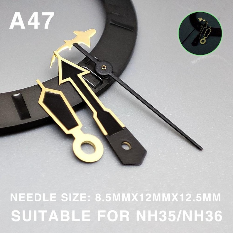 May include: Close-up of watch hands with gold and black accents. The hands include an arrow, a plane, and a straight hand. The text "A47" is visible. The text "NEEDLE SIZE: 8.5MMX12MMX12.5MM SUITABLE FOR NH35/NH36" is also visible.