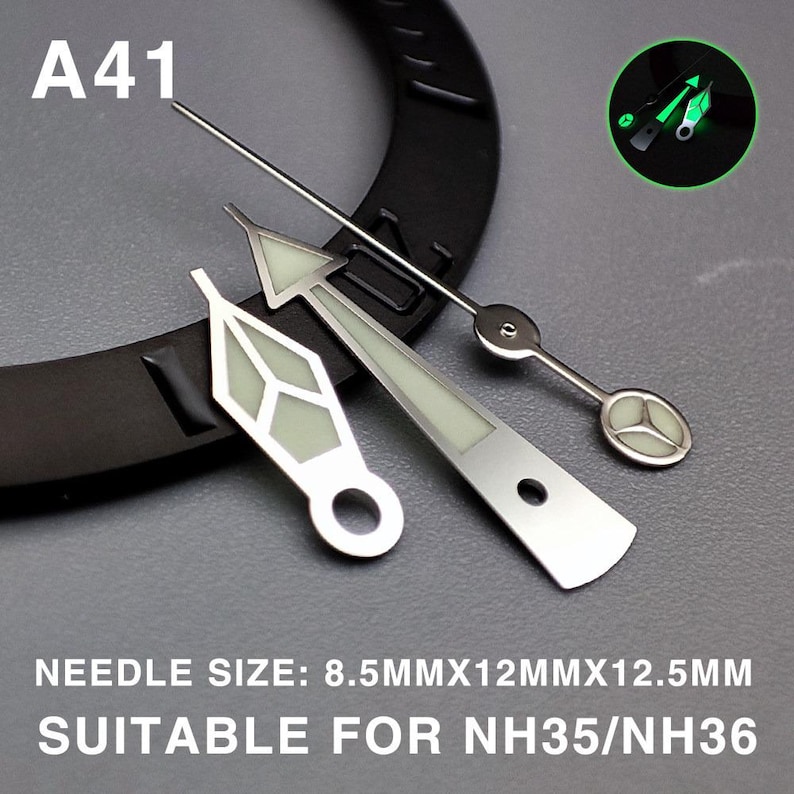 May include: A collection of watch hands in various styles, including a long, thin second hand and hands with geometric shapes. The hands are silver-toned with a luminous, light green glow. Text on the image reads "A41" and "NEEDLE SIZE: 8.5MMX12MMX12.5MM SUITABLE FOR NH35/NH36."