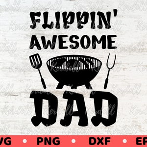 May include: Black and white graphic design with the text "Flipping Awesome Dad" and a grill with a spatula and tongs.