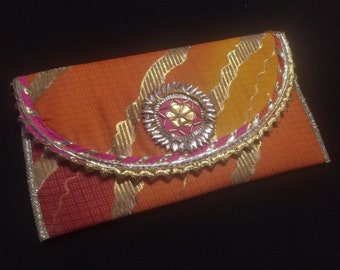 This Is Indian Multi Colour Yellow Orange And Gold Colour Decorative Handmade Applique Work Design Purse For Special Occasion Wholesalers