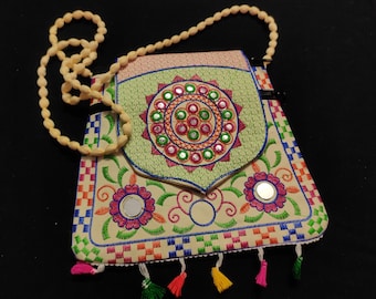 This Is Indian  Cream And Multi Colour Handmade Embroidered Rangoli Floral Design Fabric Tassels Design Bag For Occasion Wedding Gift