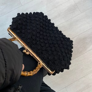 Black top handle bag