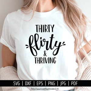 May include: White t-shirt with the text "THIRTY flirty & THRIVING" in black script. The shirt is a crew neck style. The bottom of the image includes file type options: SVG, DXF, EPS, PNG, JPG, and PDF.
