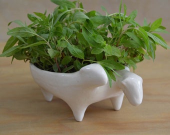 Sheep-shaped bowl design. Handmade ceramic bowl. Clay.