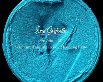 May include: A round container filled with vibrant turquoise 3D sculpture painting paste. The surface has a thick, textured, and swirled consistency. White text printed on the center reads Ezgi Sertcetin Fine Art Premium 3D Sculpture Painting Paste.