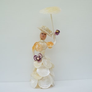 Elegant White seashell Lady with umbrella
