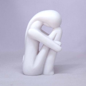 Woman hugging her feet in Cycladic art 12cm white