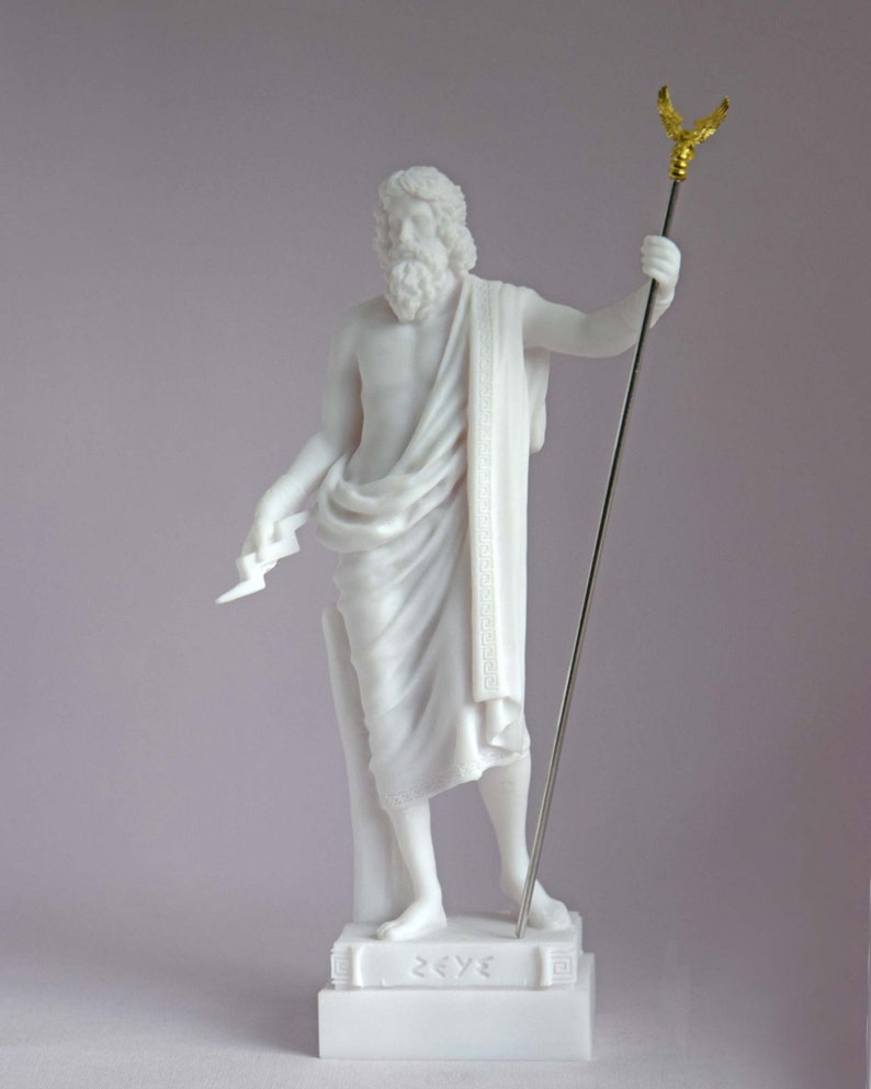 May include: White marble statue of Zeus, the Greek god of the sky and thunder, holding a lightning bolt in his left hand and a scepter with an eagle on top in his right hand. The statue is standing on a base with the word "ZEUS" inscribed on it.