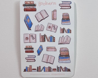 May include: A sticker sheet featuring various illustrations of books, including stacks, open books, and individual volumes. The word "Bookworm" is written at the top. The sticker sheet has a white background and includes the artist's social media handles.