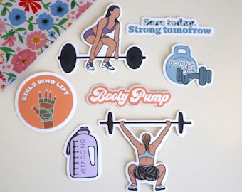 May include: A set of six colourful fitness-themed stickers. The stickers feature a woman lifting weights, a water bottle, a hand wearing weightlifting gloves, a kettlebell, and two text-based stickers that say "Girls Who Lift" and "Sore today. Strong tomorrow."