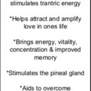 May include: Ruby gemstone, a red crystal associated with love, passion, and energy. It is believed to stimulate the root, heart, and third eye chakras. The text describes its benefits, including attracting love, boosting energy, improving concentration, and aiding the heart.
