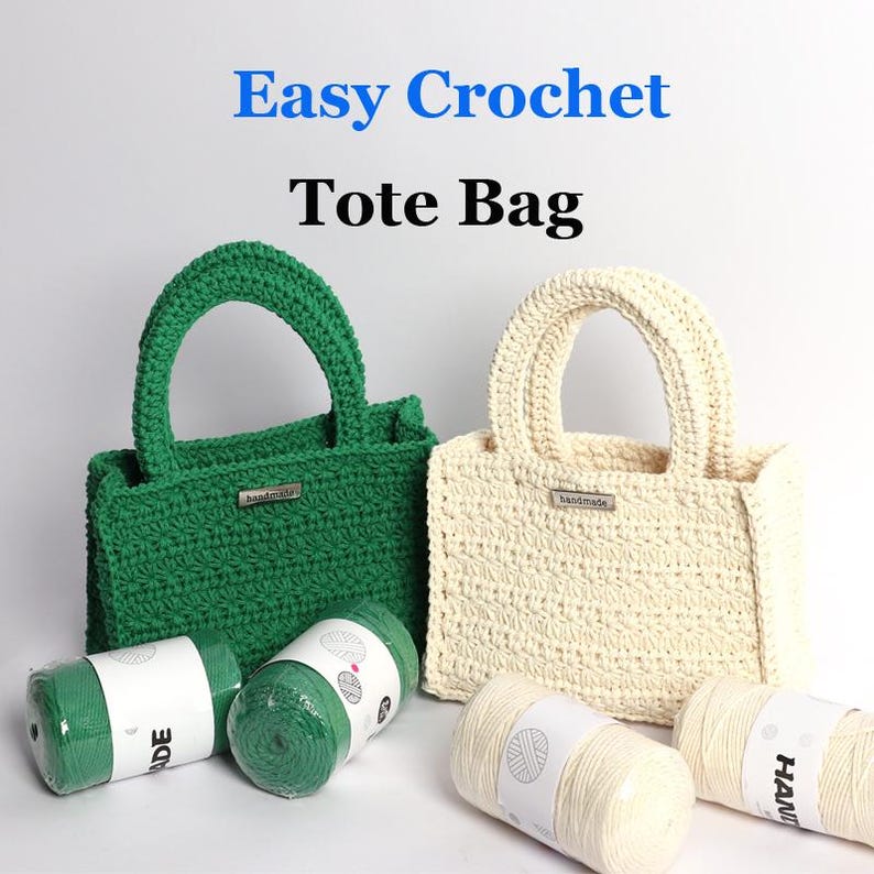 May include: Two crochet tote bags, one green and one cream, with matching yarn. The bags have arched handles and small "handmade" tags. The text "Easy Crochet Tote Bag" is displayed in blue and black.