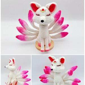 May include: White crocheted fox with pink ombre tails. The fox has closed eyes and a small beaded crown on its forehead.