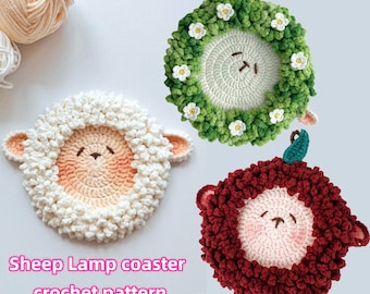 May include: Three crocheted sheep lamp coasters. One is white, one is green with white flowers, and one is red.  The coasters are shaped like sheep with a round face and a fluffy body.  Sheep Lamp Coaster Crochet Pattern.