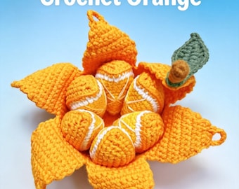 May include: A handmade crochet orange with a peeled rind revealing segmented sections. The orange is bright orange with white detailing on the segments and a single green leaf attached to a brown stem. The text Handmade Crochet Orange is visible.