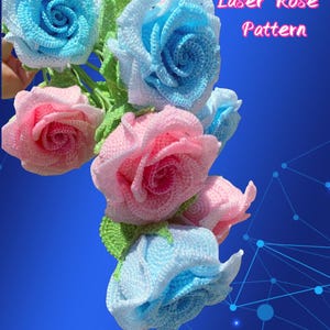 May include: A bouquet of crocheted roses in shades of pink and blue, with green leaves. The text "Laser Rose Pattern" is displayed in pink. The flowers have a detailed, textured appearance.