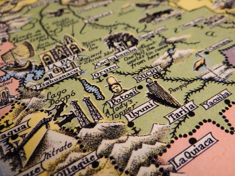 May include: A vintage map of South America, focusing on Bolivia. The map is hand-drawn and features illustrations of various landmarks and cities, including La Paz, Potosi, Sucre, and Uyuni. The map is printed on aged paper with a green background.