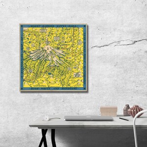 May include: A vintage map of Mount Rainier National Park in Washington state. The map is yellow with blue borders and features a stylized illustration of Mount Rainier. The text "Mount Rainier Nat'l Park" is at the top of the map and "High, White and Handsome" is at the bottom.