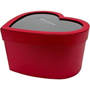 May include: A heart-shaped red gift box with a dark gray lid. The lid has a heart-shaped cutout and the words "Only Love" printed on it. The box is made of a textured material.