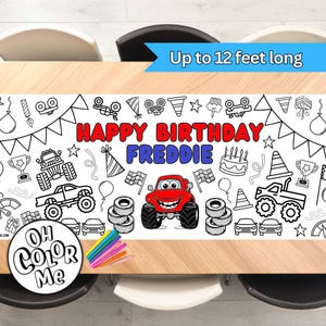 May include: A white table cover with a monster truck theme. The cover is designed for coloring with markers or crayons. It features a red monster truck with a happy face, along with other monster truck-themed illustrations. The text "Happy Birthday Freddie" is written in red and blue letters. The cover is up to 12 feet long.