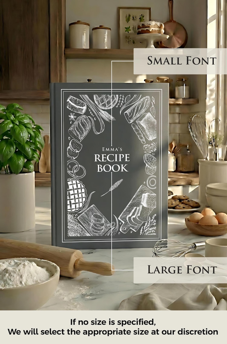 May include: A dark gray hardcover recipe book titled "Emma's Recipe Book" in white text. The cover features white line-art illustrations of various baked goods, bread, and kitchen tools arranged in a decorative border around the central text.