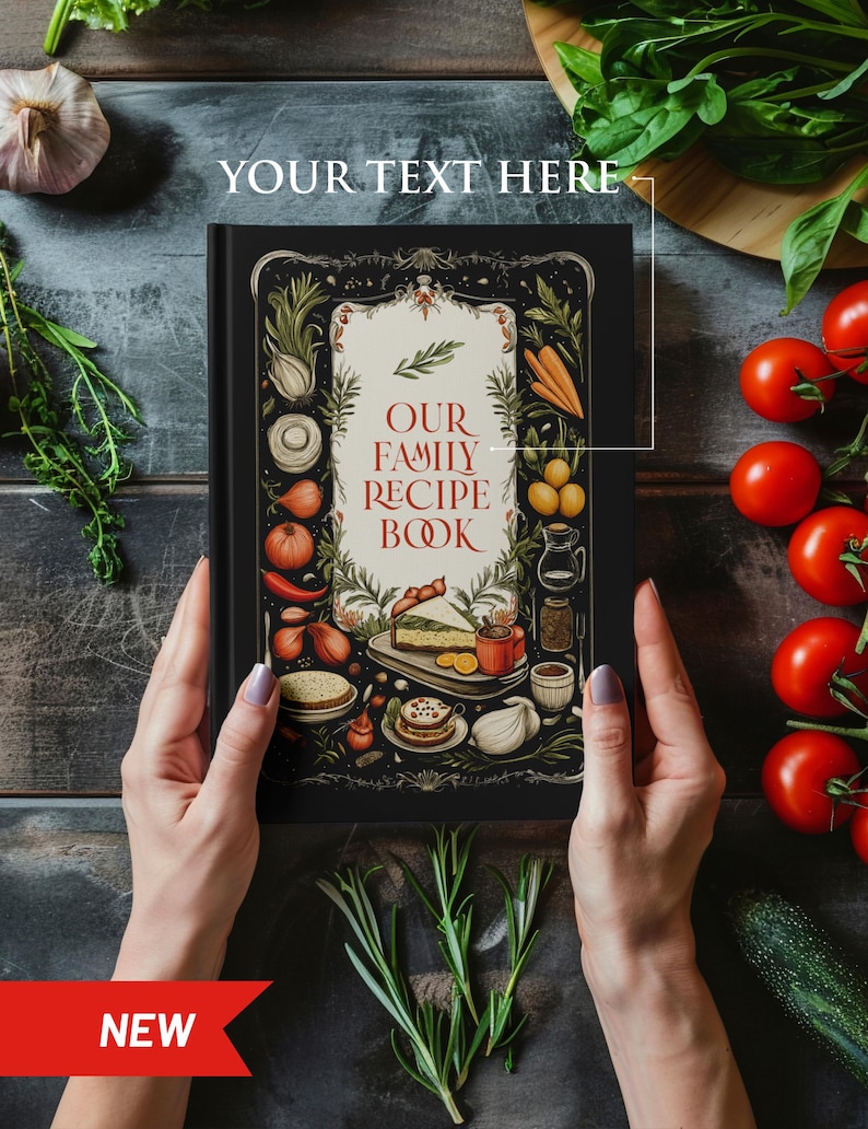 May include: A black hardcover recipe book with a colorful illustration of food and vegetables on the cover. The title of the book is "Our Family Recipe Book".