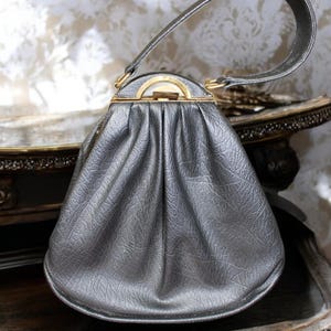Vintage Black Faux Leather Handbag with Gold Openings and Clasp