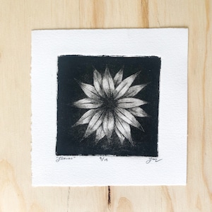 May include: Black and white print of a stylized flower with the text "Flowers" and "9/18" in the bottom left corner and the signature "Jon" in the bottom right corner.