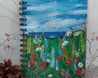 Hand painted A5 flowers and sea view lined note book. Personalised for free.