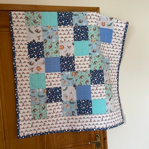 Baby play mat or throw. Machine quilted using 100% cotton. ‘Sloth and Friends’ fabrics. 34&quot; x 44&quot;.