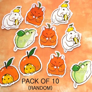 May include: A pack of 10 illustrated stickers featuring cute hamsters eating various fruits. The stickers are printed on white paper and feature a variety of colors, including orange, yellow, green, and white. The text "PACK OF 10 (RANDOM)" is printed at the bottom of the image.
