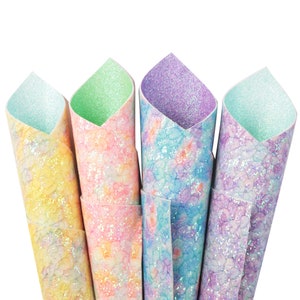 May include: Four rolls of iridescent glitter fabric in shades of yellow, pink, purple, and blue. The fabric has a subtle pattern of small, white dots.