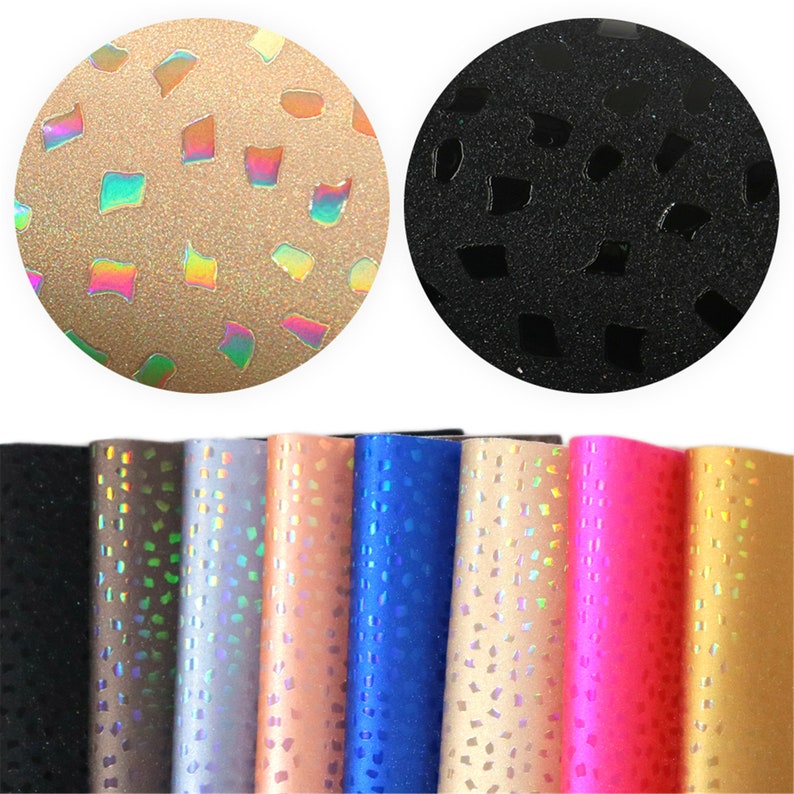 May include: Assortment of eight iridescent faux leather sheets with a geometric pattern. The sheets are in various colors, including black, brown, silver, peach, blue, gold, pink, and yellow.