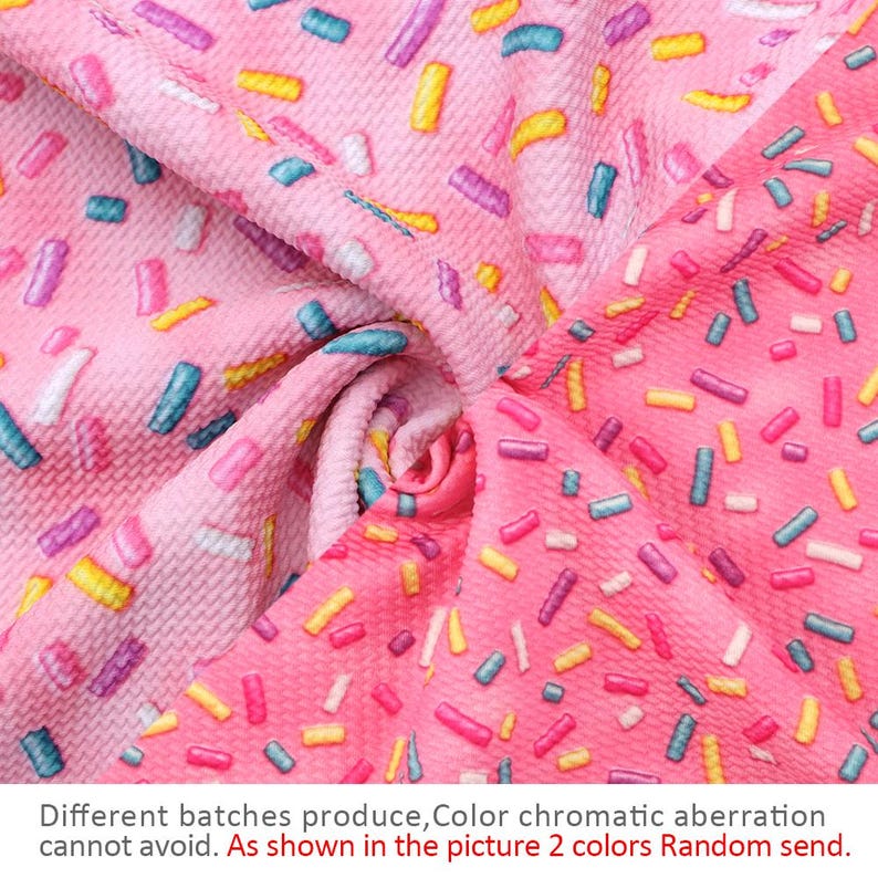 May include: Pink fabric with a sprinkle pattern in various colors, including pink, blue, yellow, and white.