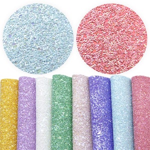 May include: Assortment of ten sheets of glitter fabric in various colors, including light blue, pink, gold, lavender, white, green, beige, purple, and light blue. The fabric has a sparkly, iridescent finish.