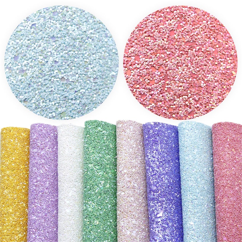 May include: Assortment of ten sheets of glitter fabric in various colors, including light blue, pink, gold, lavender, white, green, beige, purple, and light blue. The fabric has a sparkly, iridescent finish.