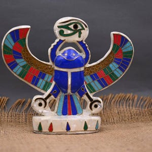 winged scarab handcrafted stone-carved, symbol of protection and good luck, ancient Egyptian mythology and dating back to BC times