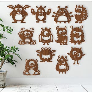 Schattige monsterontwerpen, 12 lasergesneden vormen SVG-vectorbestand, ai, cdr, dxf direct downloaden. uitsnijdingen met details