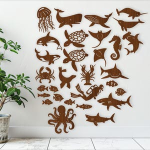 Ontwerpen met oceaandierenthema, 23 lasergesneden vijlvormen. SVG-vectorbestanden ai, cdr, dxf direct downloaden. uitsnijdingen met details