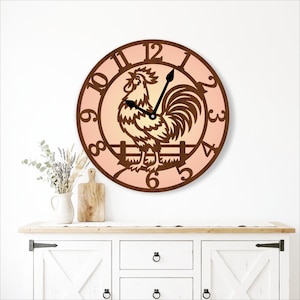 May include: A round wall clock featuring a dark brown frame and a light peach-colored face. The clock displays a dark brown silhouette of a rooster standing on a fence, with large dark brown numerals from 1 to 12 and two black clock hands.