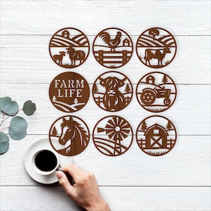May include: Nine brown wooden coasters with farm-themed designs. Each coaster features a different rural scene, including a sheep and lamb, a rooster, a cow, a tractor, a horse, a windmill, and a barn. One coaster has the text "FARM LIFE".