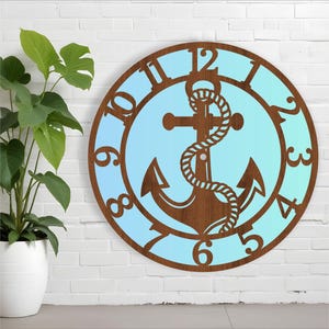 May include: A wooden clock with a blue and white gradient background. The clock face features a large anchor with a rope design. The numbers 1 through 12 are displayed around the edge of the clock.