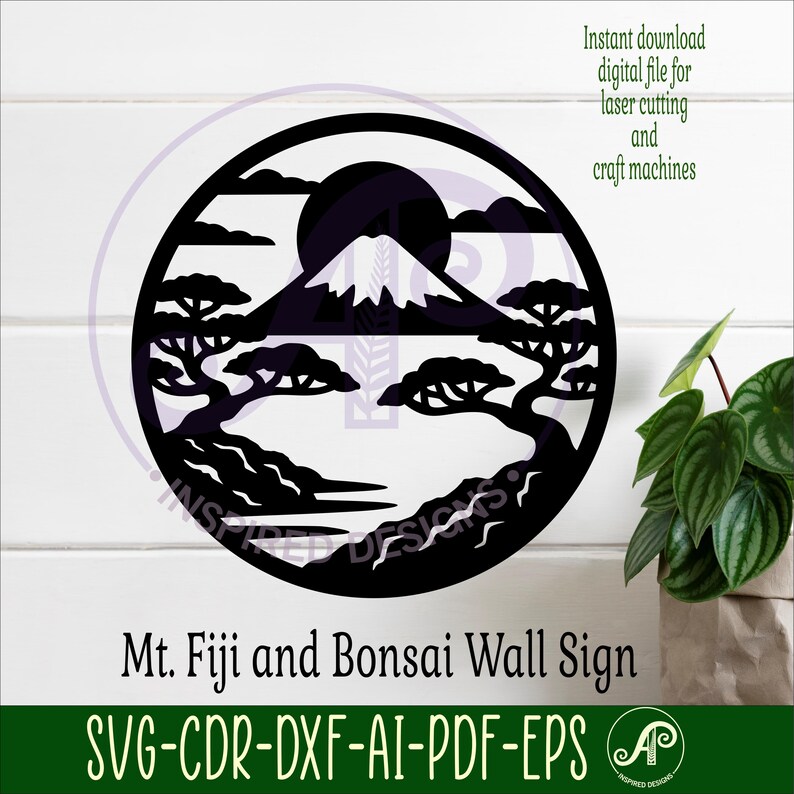May include: A black, circular wall sign featuring a silhouette of Mount Fuji, bonsai trees, and a rising sun. The sign includes the text "Mt. Fuji and Bonsai Wall Sign" and file type information. The design is suitable for laser cutting.