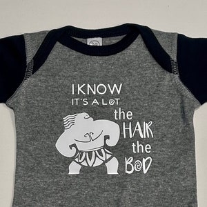 I Know It’s a Lot the Hair the Bod Maui Disney Moana Funny Baby Bodysuit Short Sleeve or Long Sleeve