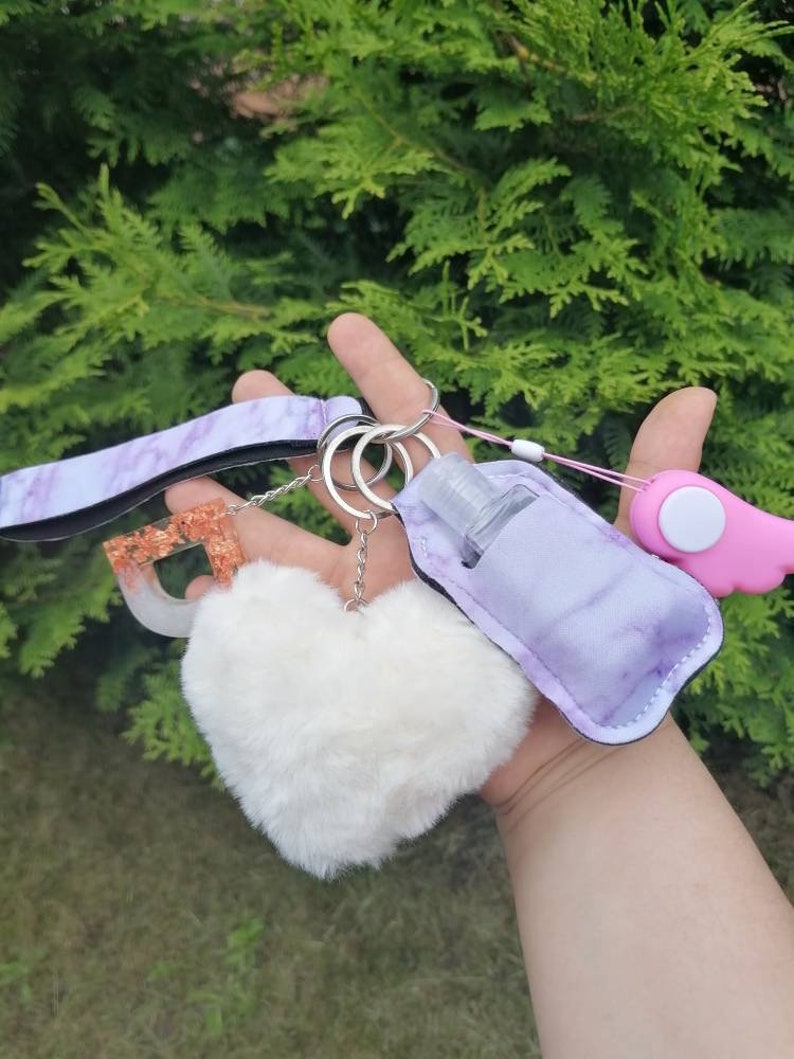 Self defense keychain keychain self defense marble pompom alarm pipe rescue disinfection bag 