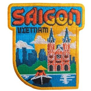 May include: Embroidered patch featuring the word "Saigon" in orange, above "Vietnam". The patch depicts a cathedral, boat, and skyline in blue, orange, and green. The patch has a yellow border.