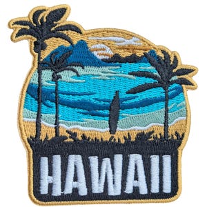 May include: Embroidered patch depicting a Hawaiian beach scene with palm trees, ocean waves, and a surfboard. The patch features the word "HAWAII" in white block letters at the bottom, with a gold border.