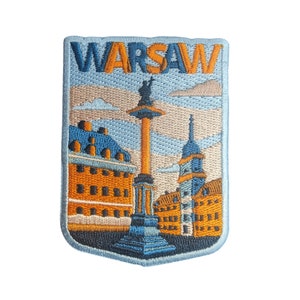 Può includere: Toppa ricamata con una vista di Varsavia, Polonia, in blu, arancione e bianco. La toppa ha la parola "WARSAW" in lettere arancioni in alto.