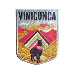 May include: Embroidered patch featuring a colourful mountain range and a black llama in front of it. The patch has the text "VINICUNCA" at the top.