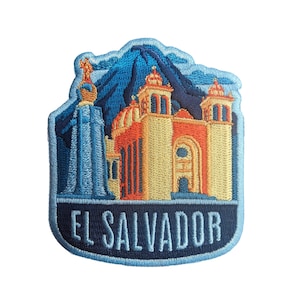 May include: Embroidered patch featuring a blue and yellow church building with a blue volcano in the background. The text "EL SALVADOR" is written in blue on a dark blue banner.